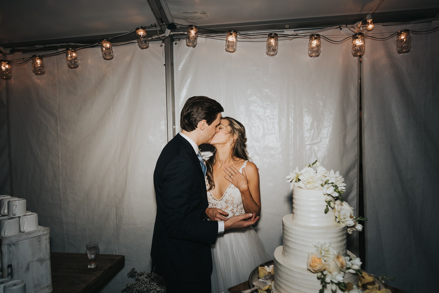 Wedding Photographer, Bride and Groom kiss at their reception